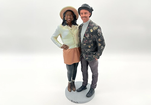 3D-printed replica of a stylish couple on a display base